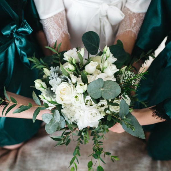 The bride and her friends hold a wedding bouquet The bride and her friends hold a wedding bouquet